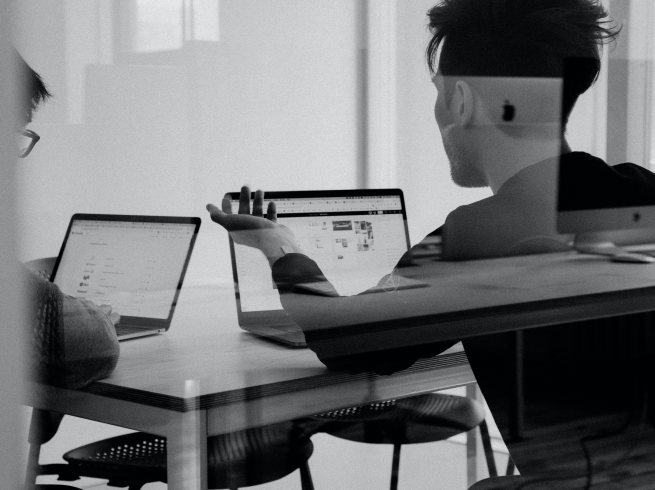 CBmobile team collaborating around laptops